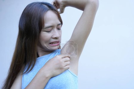 Photo for Asian women have damp armpits. - Royalty Free Image