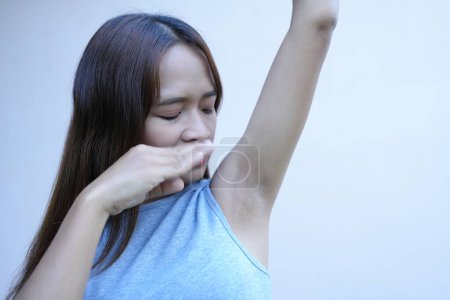 Photo for Asian women have damp armpits. - Royalty Free Image