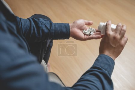 Photo for The person using drug overdoses. close up on pills in hand. - Royalty Free Image