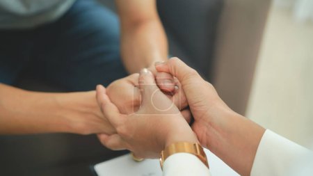 Photo for Woman holding hands of the stressed man about mental health problem - Royalty Free Image