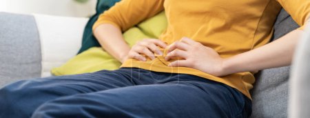 Photo for Close up woman suffering stomach pain from food poisoning. - Royalty Free Image