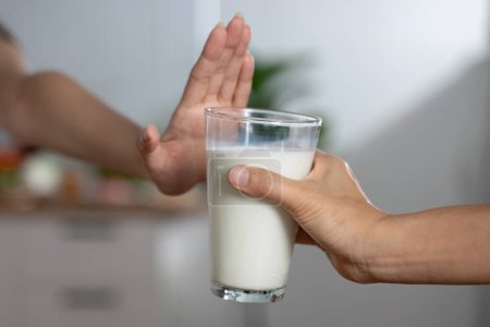 Foto de Person deny to drink milk because lactose tolerance - Imagen libre de derechos