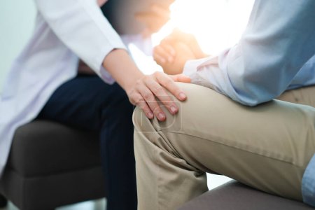 Téléchargez les photos : Men talk with a psychologist during talking therapy stressed mental health at office - en image libre de droit