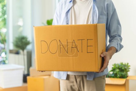 Téléchargez les photos : People preparing clothes in donation box preparing to give to another people - en image libre de droit