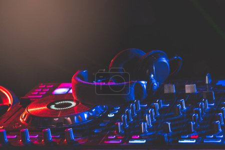 Photo for Headphone on turntable adjustment in club - Royalty Free Image