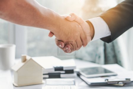 Photo for Close up view of Businessman and client shaking hands after contract agreement done deal. - Royalty Free Image