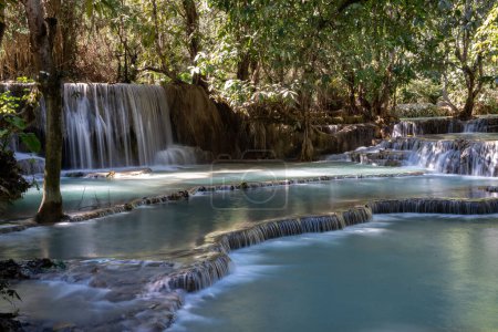 The Kuang Si Waterfall is located 30 km to the south of Luang Prabang in the Southeast Asian country of Laos