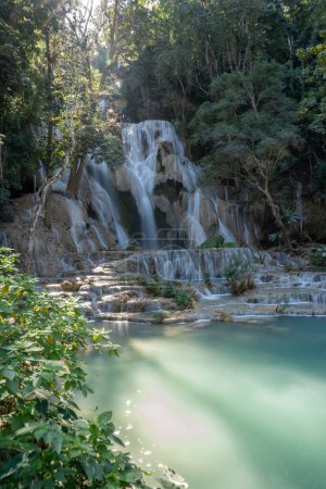 The Kuang Si Waterfall is located 30 km to the south of Luang Prabang in the Southeast Asian country of Laos