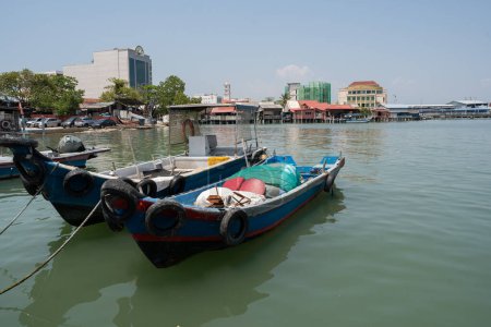 Chew Jetty on Penang in Malaysia is a place with wooden houses on wild constructions and piers in the water.