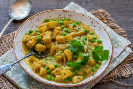 Photo for Coconut and potato curry with green peas - Royalty Free Image