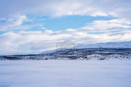 Frozen lake Tornetrask in Abisko, Sweden