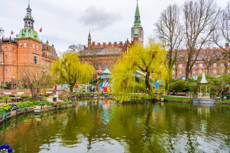 Photo for COPENHAGEN, DENMARK - APRIL 15 2024: Tivoli Gardens in Copenhagen is the world's second-oldest, 19th-century amusement park with antique roller coaster and live entertainment program. - Royalty Free Image