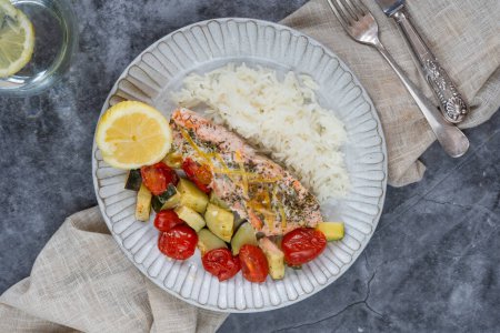 Oven baked salmon and vegetables with rice