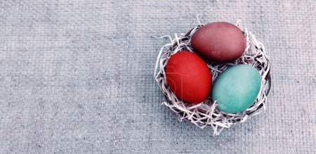 Photo for Colorful easter eggs on gray cloth background.Spring greeting card. - Royalty Free Image