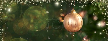 Photo for Christmas tree branch with golden ball and blur background. - Royalty Free Image