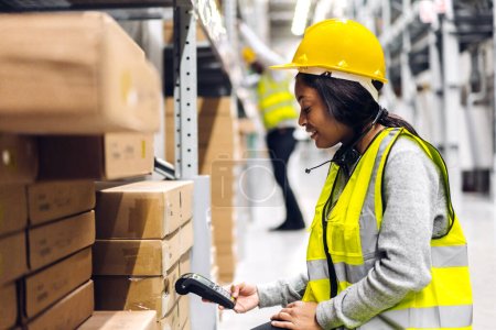Photo for Portrait of african american engineer woman scanning package with barcode scanner check goods in transportation and distribution in warehouse.logistic Industrial and business export - Royalty Free Image