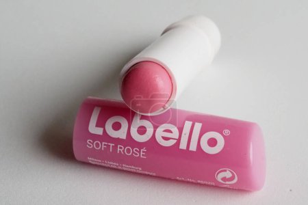 Photo for In this Illustration. Labello pink lip balm. The name of the Labello company created in 1909, derives from the Latin ""labium"" and ""bellus"", or rather ""lips"" and ""bello"". - Royalty Free Image