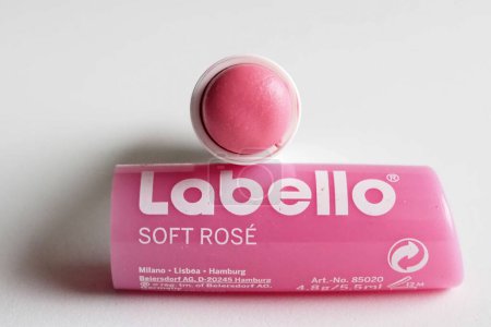 Photo for In this Illustration. Labello pink lip balm. The name of the Labello company created in 1909, derives from the Latin ""labium"" and ""bellus"", or rather ""lips"" and ""bello"". - Royalty Free Image