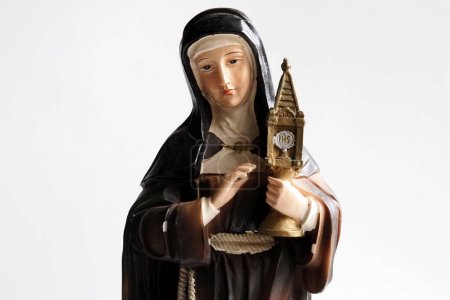 Photo for In this Illustration. Statuette symbolizing Santa Chiara, founder of the order of the Poor Clares. She was canonized as Santa Chiara in 1255, while on 17 February 1958 she was declared by Pius XII she was the patron saint of television and telecommun - Royalty Free Image