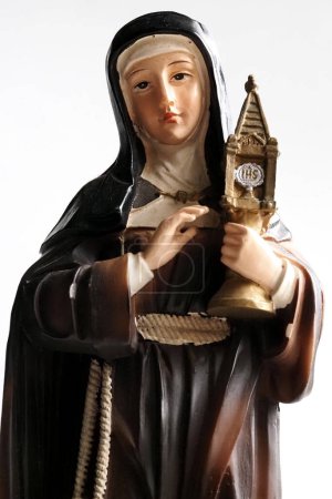 Photo for In this Illustration. Statuette symbolizing Santa Chiara, founder of the order of the Poor Clares. She was canonized as Santa Chiara in 1255, while on 17 February 1958 she was declared by Pius XII she was the patron saint of television and telecommun - Royalty Free Image