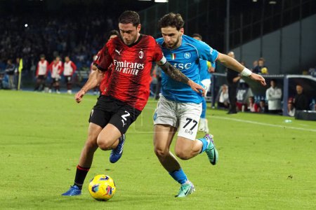 Photo for Khvicha Kvaratskhelia player of Napoli and Davide Calabria player of Milan, during the match of the Italian Serie A league between Napoli vs Milan final result, Napoli 2, Milan 2, match played at the Diego Armando Maradona stadium. - Royalty Free Image