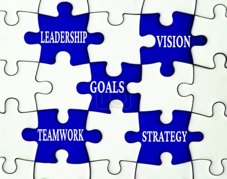 Foto de Business concept. Leadership, vision, goals, teamwork, and strategy text on missing jigsaw. - Imagen libre de derechos