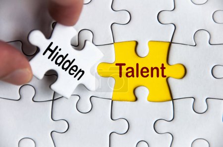 Foto de Hidden talent text on missing jigsaw puzzle. Business idea concept. - Imagen libre de derechos
