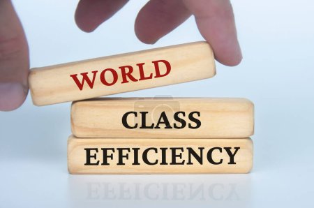 Photo for World class efficiency text on wooden blocks. Business culture and Operational excellence concept. - Royalty Free Image