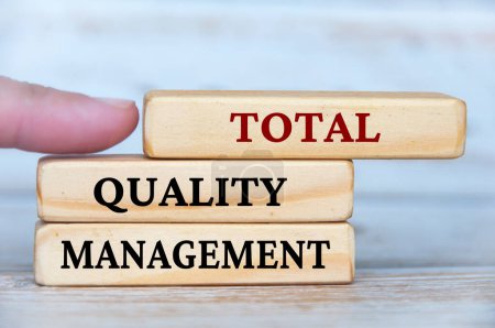 Photo for Total quality management text on wooden blocks. Business culture and Operational excellence concept. - Royalty Free Image