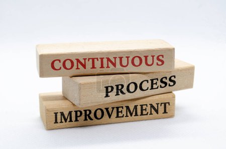 Photo for Continuous process improvement text on wooden blocks. Business culture and Operational excellence concept. - Royalty Free Image