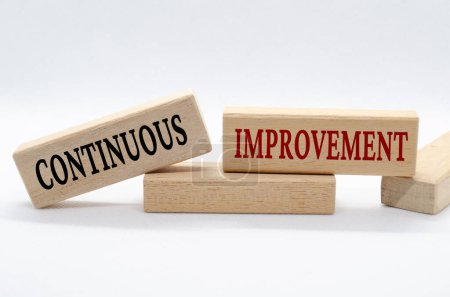 Photo for Continuous improvement text on wooden blocks. Business culture and Operational excellence concept. - Royalty Free Image