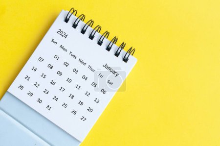 Photo for January 2024 table calendar on yellow cover background with customizable space for text. - Royalty Free Image