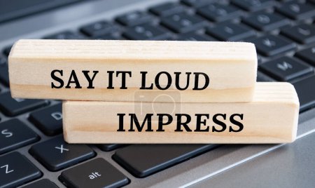 Photo for Say it loud and impress text on wooden blocks. Business concept. - Royalty Free Image