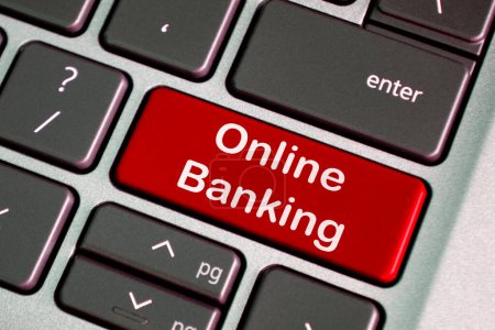 Texte bancaire en ligne sur clavier d'ordinateur portable rouge. Concept de banque et de sécurité en ligne.