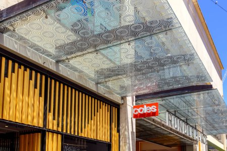 Photo for Adelaide, South Australia - December 28, 2022: Coles Supermarkets logo sign above entrance to Rundle Place shopping center in Adelaide CBD while viewed from Rundle Mall on a bright day - Royalty Free Image