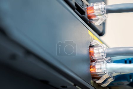 Photo for Network Gigabit Smart PoE Switch with  connected network cables getting tested on the desk - Royalty Free Image