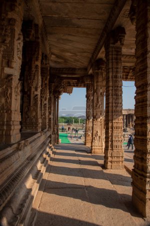 Photo for Beautifully carved pillars in the Vijaya Vitthala temple complex in Hampi. Hampi, the capital of the Vijayanagara Empire is a UNESCO World Heritage site. - Royalty Free Image