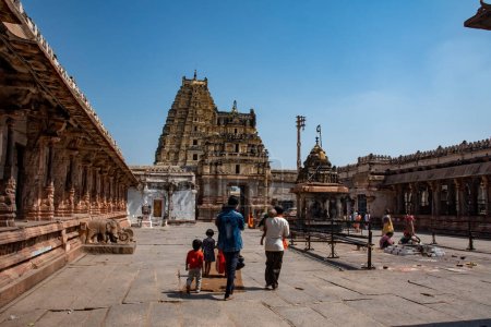 Photo for Hampi, Karnataka, India - Oct 31 2022: Virupaksha Temple dedicated to lord Shiva is located in Hampi in Karnataka, India. Hampi, the capital of Vijayanagar Empire is a UNESCO World Heritage site. - Royalty Free Image
