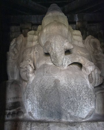 Photo for Kadalekalu Ganesha Temple in Hampi has a huge statue of Lord Ganesha, carved out of a single block of rock. Hampi, the capital of the Vijayanagar empire is a UNESCO World Heritage site. - Royalty Free Image