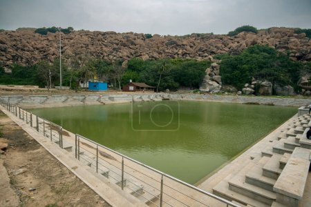 Photo for Pampa lake near Hampi is one of the most sacred lakes in Hinduism. Hampi, the capital of the Vijayanagar Empire, is a UNESCO World Heritage site. - Royalty Free Image