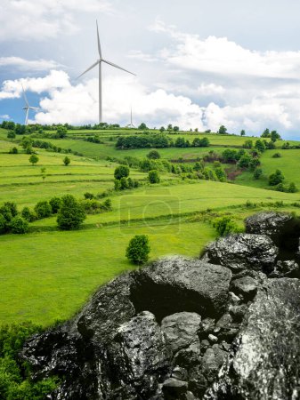 Photo for Wind turbines and coal ore, energy transition concept - Royalty Free Image
