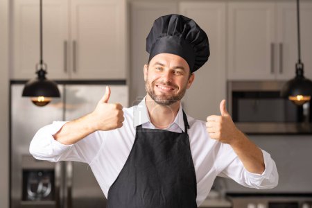 A professional chef in a modern kitchen is gesturing upwards, fully focused on cooking a delicious meal