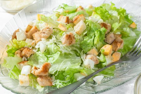 Caesar salad in a plate close-up