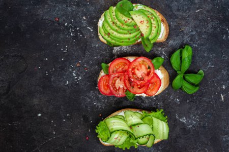 Sandwiches with tomato, avocado and cucumber