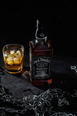Photo for Bottle of whiskey Jack Daniels on a dark background - Royalty Free Image