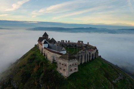 Téléchargez les photos : Aerial view about castle of Sumeg with foggy sunrise at the background. - en image libre de droit