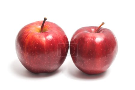 Two fresh organic red apple delicious fruit side view isolated on white background clipping path