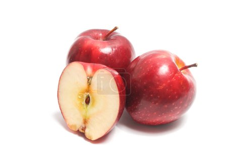 Half cut and two whole fresh organic red apple delicious fruit isolated on white background clipping path