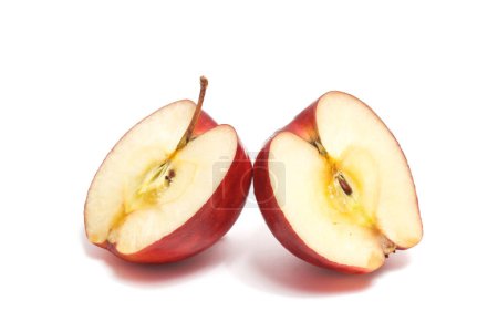 Half cut fresh organic red apple delicious fruit side view isolated on white background clipping path