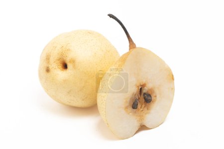 Half cut and whole fresh organic yellow pear delicious fruit isolated on white background clipping path